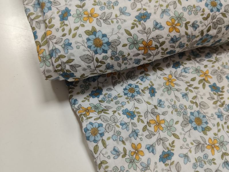 Tela MUSELINA FLOR AZUL Y MOSTAZA