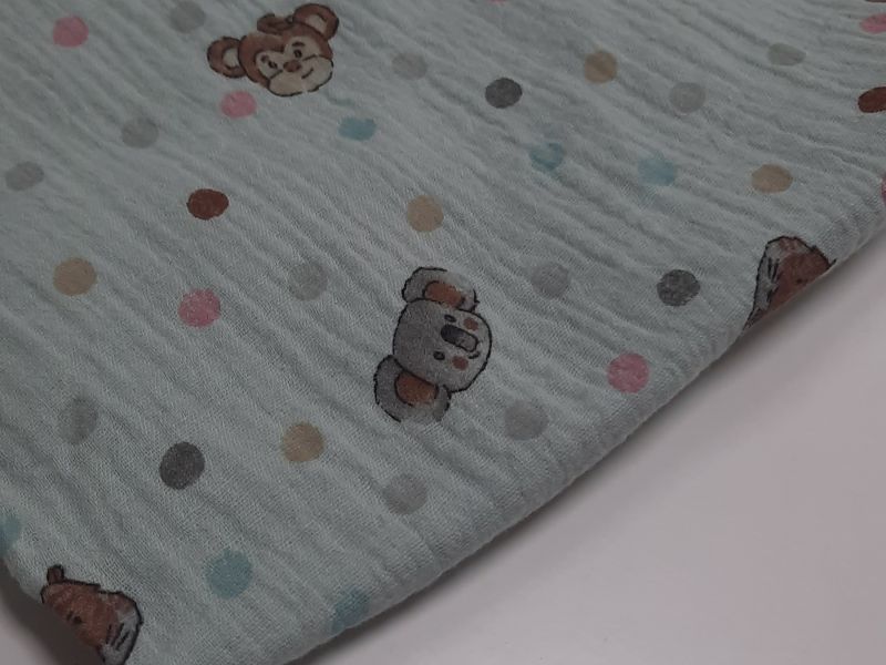 TELA MUSELUNA FONDO VERDE CARA ANIMALES 